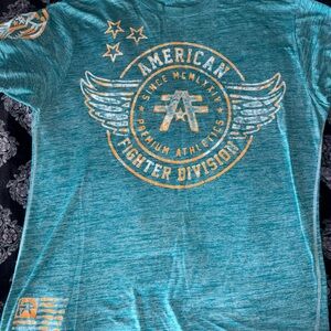 Teal Graphic American Fighter T-Shirt with Orange Details.